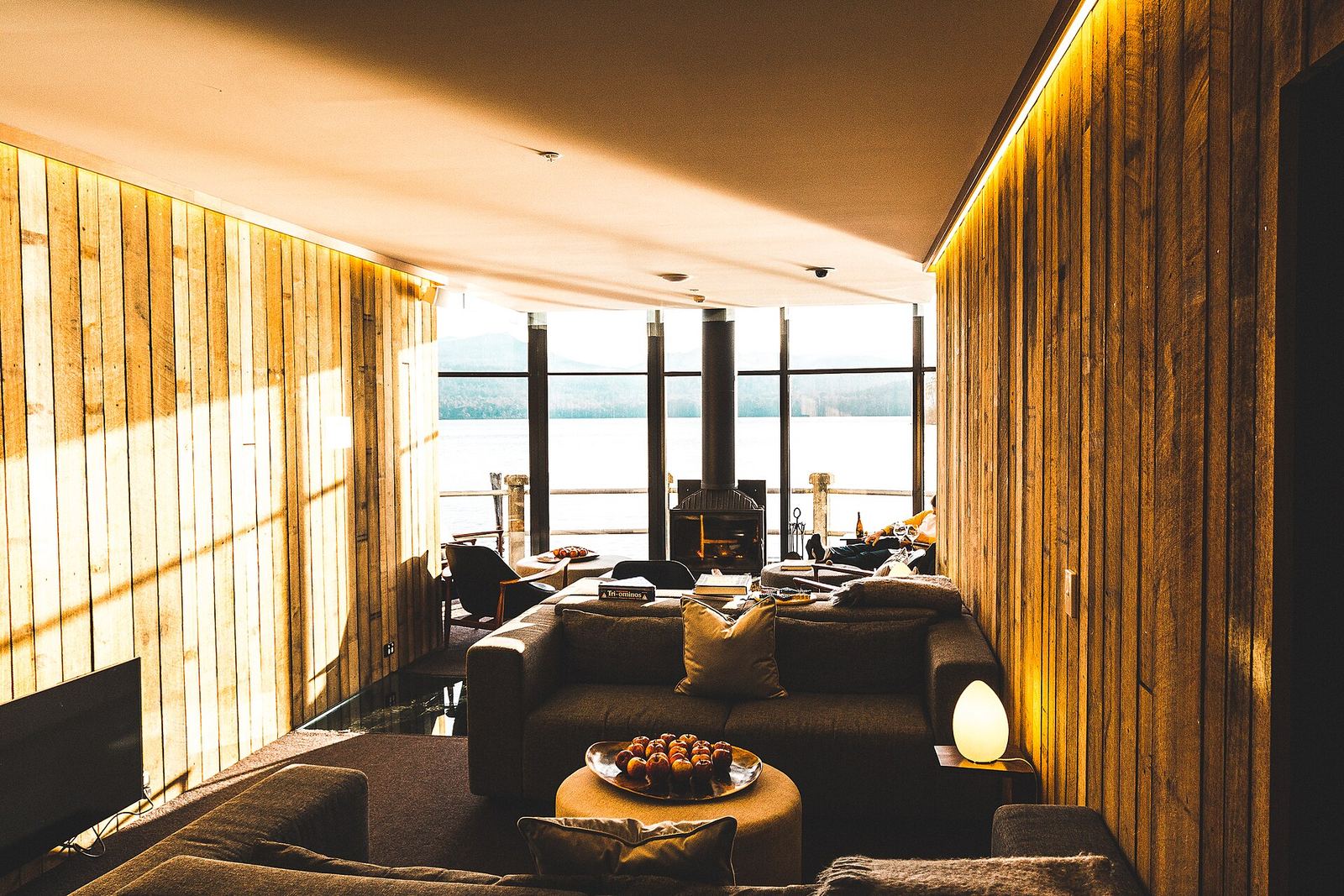 Open-plan living room with lake view
